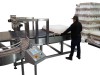 Indexing Conveyor - De-Traying or De-Bagging